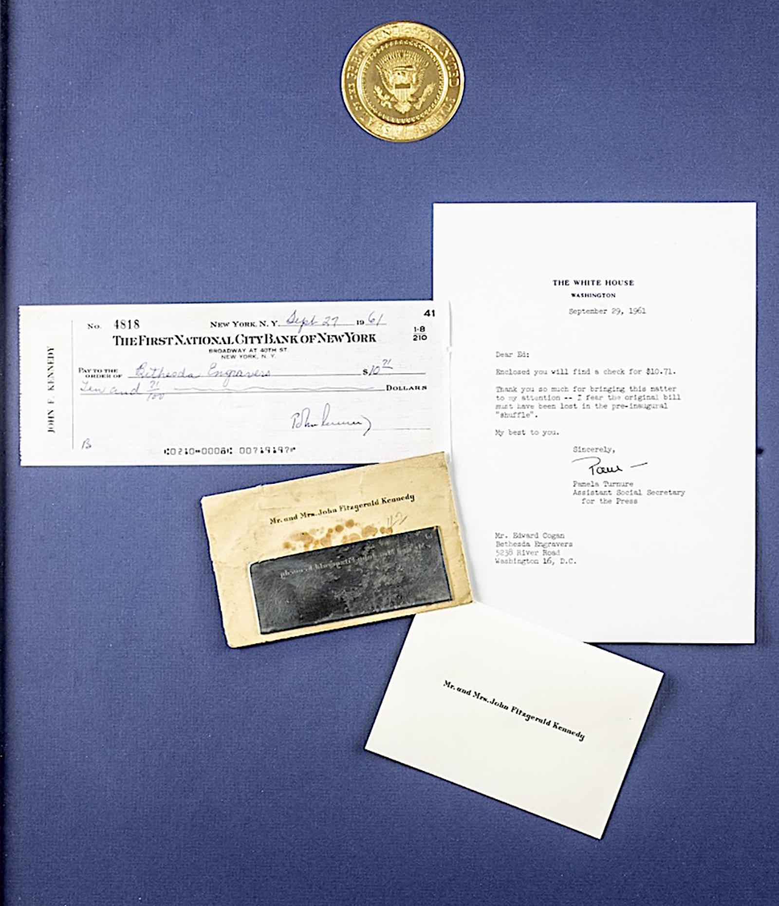 Framed presentation including check drawn on First National City Bank of New York account of ‘John F Kennedy,’