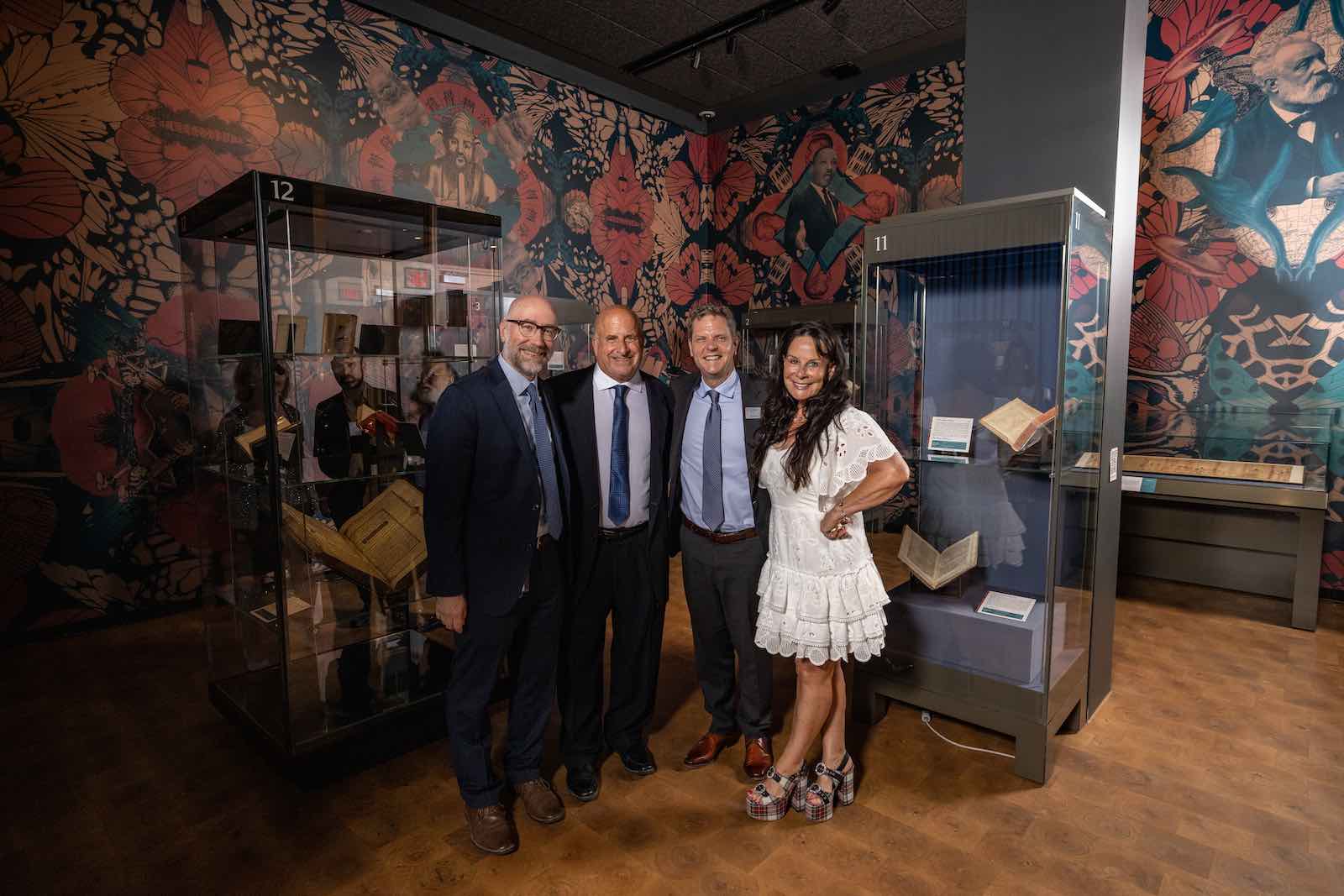 Greg Prickman, Eric Weinmann Librarian and Director of Collections and Exhibitions at the Folger Shakespeare Library; Stuart Rose; Michael Witmore, Director of the Folger Shakespeare Library; and Mimi Rose at the exhibition Imprints in Time