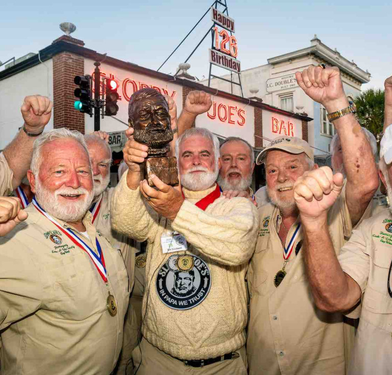 Tim Stockwell of Key West, Florida, celebrates his victory with a group of past winners